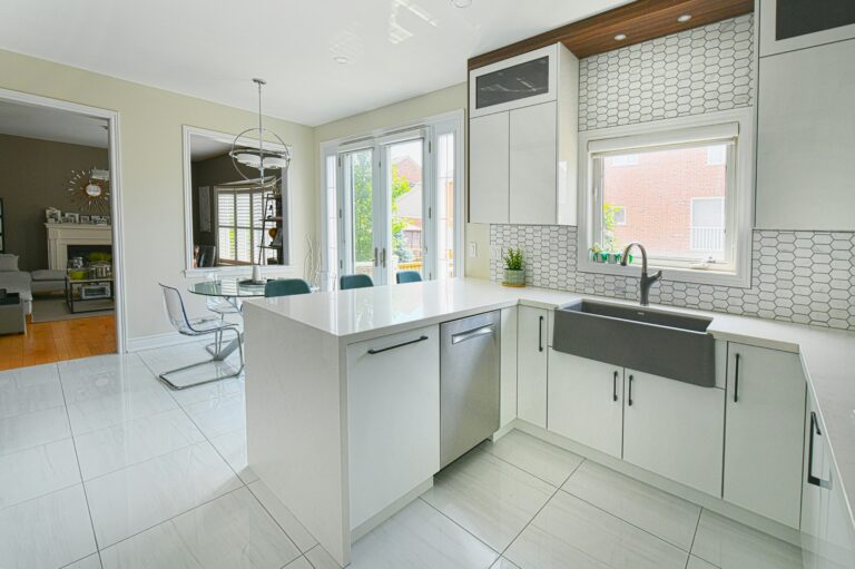 modern white kitchen with island and dining area